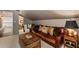 Second bonus room with vintage leather sofa and rustic furnishings and comfortable decor at 1466 University Dr, Atlanta, GA 30306