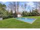A backyard pool surrounded by a green lawn, offering a refreshing oasis at 1466 University Dr, Atlanta, GA 30306