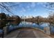 Scenic view of the Atlanta skyline reflecting in a tranquil lake from a stone overlook at 1466 University Dr, Atlanta, GA 30306