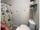 Bathroom featuring shower with floral curtain and modern storage at 5609 Windwood Rd, Atlanta, GA 30349