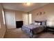 Bedroom with neutral walls, carpet, and three decorative wall pieces at 5609 Windwood Rd, Atlanta, GA 30349