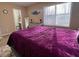 Spacious main bedroom with large windows, and a view to the ensuite bathroom at 5609 Windwood Rd, Atlanta, GA 30349