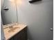 Bathroom featuring a pedestal sink and modern fixtures at 5609 Windwood Rd, Atlanta, GA 30349