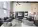 Inviting living room featuring modern decor, high ceilings, and access to a kitchen bar at 572 Edgewood Ne Ave # 301, Atlanta, GA 30312