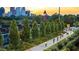 Scenic trail in an urban park with people biking and the city skyline in the background at 572 Edgewood Ne Ave # 301, Atlanta, GA 30312