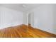 Bedroom features hardwood floors, a ceiling fan, and an entry to another room at 795 Ponce De Leon Ne Pl # C3, Atlanta, GA 30306