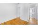 This is a bedroom with hardwood floors and white walls next to a bathroom at 795 Ponce De Leon Ne Pl # C3, Atlanta, GA 30306