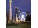 Nighttime view of Centennial Olympic Park, showcasing the Ferris wheel, monuments, and city skyline at 795 Ponce De Leon Ne Pl # C3, Atlanta, GA 30306