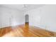 Spacious vacant room boasting pristine hardwood floors, clean white walls, and an archway at 795 Ponce De Leon Ne Pl # C3, Atlanta, GA 30306