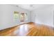Bright empty room with hardwood floors and patio access, ready for your personal touch at 795 Ponce De Leon Ne Pl # C3, Atlanta, GA 30306