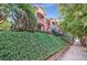Multi-story brick building with manicured landscaping and charming balconies nestled among lush green trees and foliage at 795 Ponce De Leon Ne Pl # C3, Atlanta, GA 30306