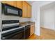 The kitchen area features a wooden sink and a stove and microwave at 795 Ponce De Leon Ne Pl # C3, Atlanta, GA 30306