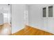 An open space with hardwood floors and white walls next to the kitchen at 795 Ponce De Leon Ne Pl # C3, Atlanta, GA 30306