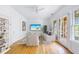 Bright living room with hardwood floors, modern furnishings, and access to an outdoor patio at 795 Ponce De Leon Ne Pl # C3, Atlanta, GA 30306