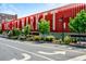 Daytime view of the popular Ponce City Market featuring a bright red exterior and clear signage at 795 Ponce De Leon Ne Pl # C3, Atlanta, GA 30306
