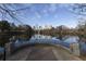 Scenic view of the Atlanta skyline reflecting in the water, with a decorative stone walkway in the foreground at 795 Ponce De Leon Ne Pl # C3, Atlanta, GA 30306