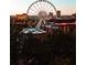 Scenic view of the Skyview Ferris wheel against the city skyline, with lush greenery in the foreground at 795 Ponce De Leon Ne Pl # C3, Atlanta, GA 30306