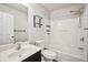 Bathroom featuring a vanity, toilet, and shower-tub combo with white walls at 2726 Pierce Brennen Ct, Lawrenceville, GA 30043