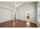 Large bedroom showing hardwood floors, neutral walls, and entryway to bath at 2726 Pierce Brennen Ct, Lawrenceville, GA 30043