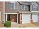 Close up of the exterior of the townhome with front door at 2726 Pierce Brennen Ct, Lawrenceville, GA 30043