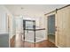 Hallway featuring wood floors and barn door access to a storage area at 2726 Pierce Brennen Ct, Lawrenceville, GA 30043