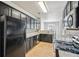 Kitchen with granite countertops and black appliances at 2726 Pierce Brennen Ct, Lawrenceville, GA 30043