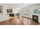 Cozy living room with a fireplace, dining area, and kitchen at 2726 Pierce Brennen Ct, Lawrenceville, GA 30043
