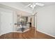 Loft featuring hardwood floors and staircase with black handrail and white spindles at 2726 Pierce Brennen Ct, Lawrenceville, GA 30043