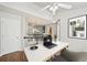 Bright home office space featuring a modern desk, stylish decor, and a ceiling fan at 2726 Pierce Brennen Ct, Lawrenceville, GA 30043