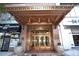 The William Oliver building entrance with gold canopy, gold doors, and planters on either side of the doorway at 32 Peachtree Nw St # 202, Atlanta, GA 30303