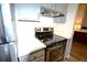 Close-up of a kitchen with stainless steel appliances and granite countertops at 32 Peachtree Nw St # 202, Atlanta, GA 30303
