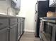 Modern kitchen featuring stainless steel appliances and gray cabinets at 32 Peachtree Nw St # 202, Atlanta, GA 30303