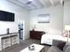 Stylish living space featuring modern furnishings, a television, and an open layout, perfect for comfortable living and entertaining at 32 Peachtree Nw St # 202, Atlanta, GA 30303