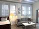 Cozy living room with large windows, couch, and coffee table at 32 Peachtree Nw St # 202, Atlanta, GA 30303