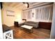 Bright living space with hardwood floors, white walls, a comfortable couch, and large windows for natural light at 32 Peachtree Nw St # 202, Atlanta, GA 30303