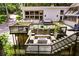 Expansive backyard featuring a fire pit, dining area, bar, and hot tub, great for outdoor enjoyment at 385 Grimes Bridge Rd, Roswell, GA 30075
