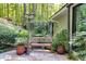 Cozy backyard patio with bench, plants, and stone pavers at 385 Grimes Bridge Rd, Roswell, GA 30075