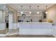 Charming bar area with white cabinets, a marble countertop, and modern pendant lighting at 385 Grimes Bridge Rd, Roswell, GA 30075