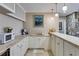 Bar area with white cabinets, countertop, and modern appliances, ideal for entertaining guests at 385 Grimes Bridge Rd, Roswell, GA 30075