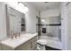 Bathroom featuring a modern vanity with a rectangular mirror and a tiled shower and tub combo at 385 Grimes Bridge Rd, Roswell, GA 30075