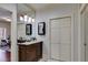 Cozy bathroom features a classic vanity, framed mirror, and ample closet space, combining style and functionality at 385 Grimes Bridge Rd, Roswell, GA 30075