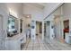 Bright bathroom boasts dual vanities, tiled floors, and mirrored closet doors, creating a serene and functional space at 385 Grimes Bridge Rd, Roswell, GA 30075