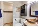 Modern bathroom features a glass vessel sink, updated cabinets and stylish tile floors at 385 Grimes Bridge Rd, Roswell, GA 30075