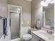 Bathroom with a glass-enclosed shower, vanity, toilet, and neutral color scheme at 385 Grimes Bridge Rd, Roswell, GA 30075