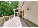 Expansive deck with stone accents, bench seating and peaceful outdoor living at 385 Grimes Bridge Rd, Roswell, GA 30075
