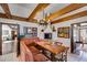 Cozy dining area with built-in booth seating, fireplace, and wooden beams at 385 Grimes Bridge Rd, Roswell, GA 30075