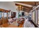 Classic dining room with chandelier, vaulted ceilings, and natural light, perfect for gathering and entertaining at 385 Grimes Bridge Rd, Roswell, GA 30075
