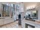 Bright dressing room featuring expansive mirrors, lots of vanity space, and large windows at 385 Grimes Bridge Rd, Roswell, GA 30075
