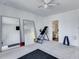 Exercise room with a ceiling fan, full-length mirrors, and workout equipment at 385 Grimes Bridge Rd, Roswell, GA 30075