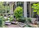 Landscaped exterior with natural stone and lush greenery at 385 Grimes Bridge Rd, Roswell, GA 30075